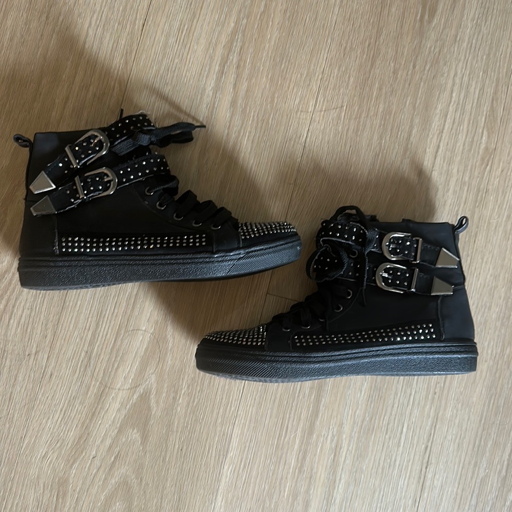 Studded black sneakers